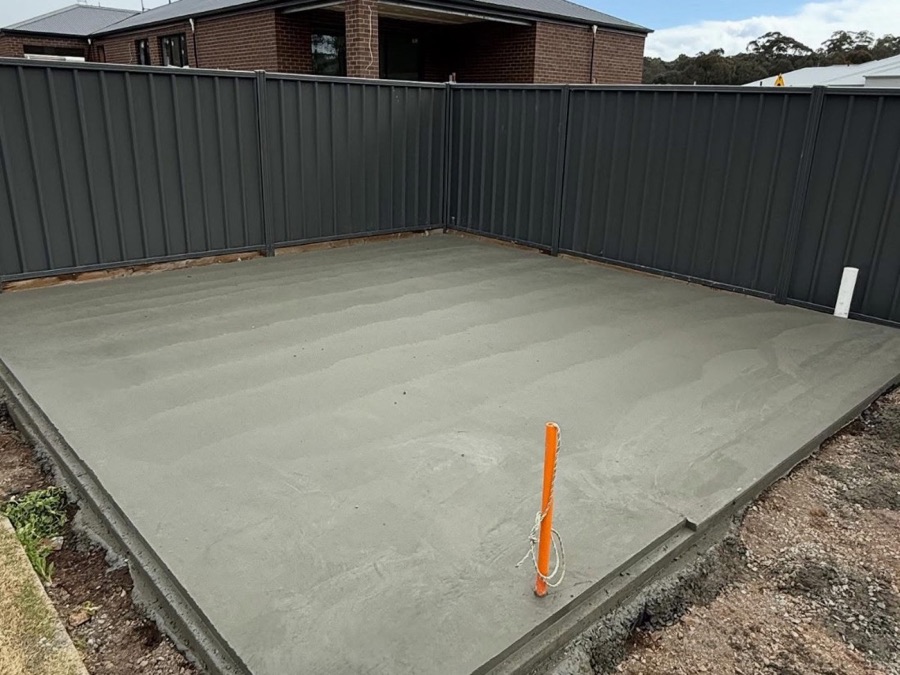 A freshly finished shed pad formed up inside a Colorbond fence line