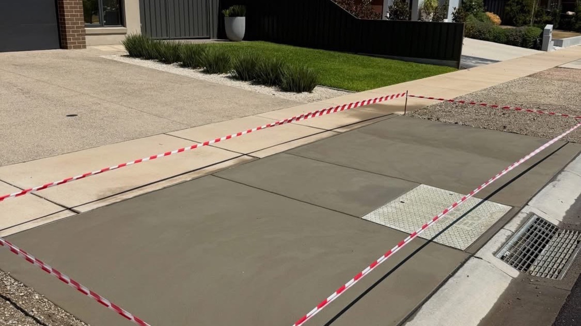 A new concrete driveway and crossover running out to the street in a Bendigo estate