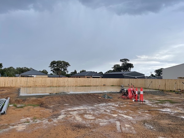 A prepared and levelled site pegged out and ready for a pour
